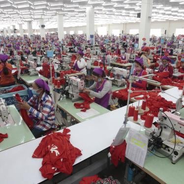 Garment workers in a factory await a visit by Prime Minister Hun Sen outside of Phnom Penh, Cambodia, August 30, 2017.