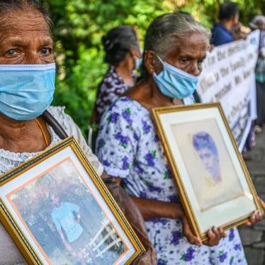 Women hold portraits of family members who went missing during Sri Lanka’s civil war that ended in 2009, during a demonstration in Colombo.