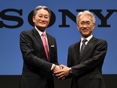 Sony president and CEO Kazuo Hirai shake hands