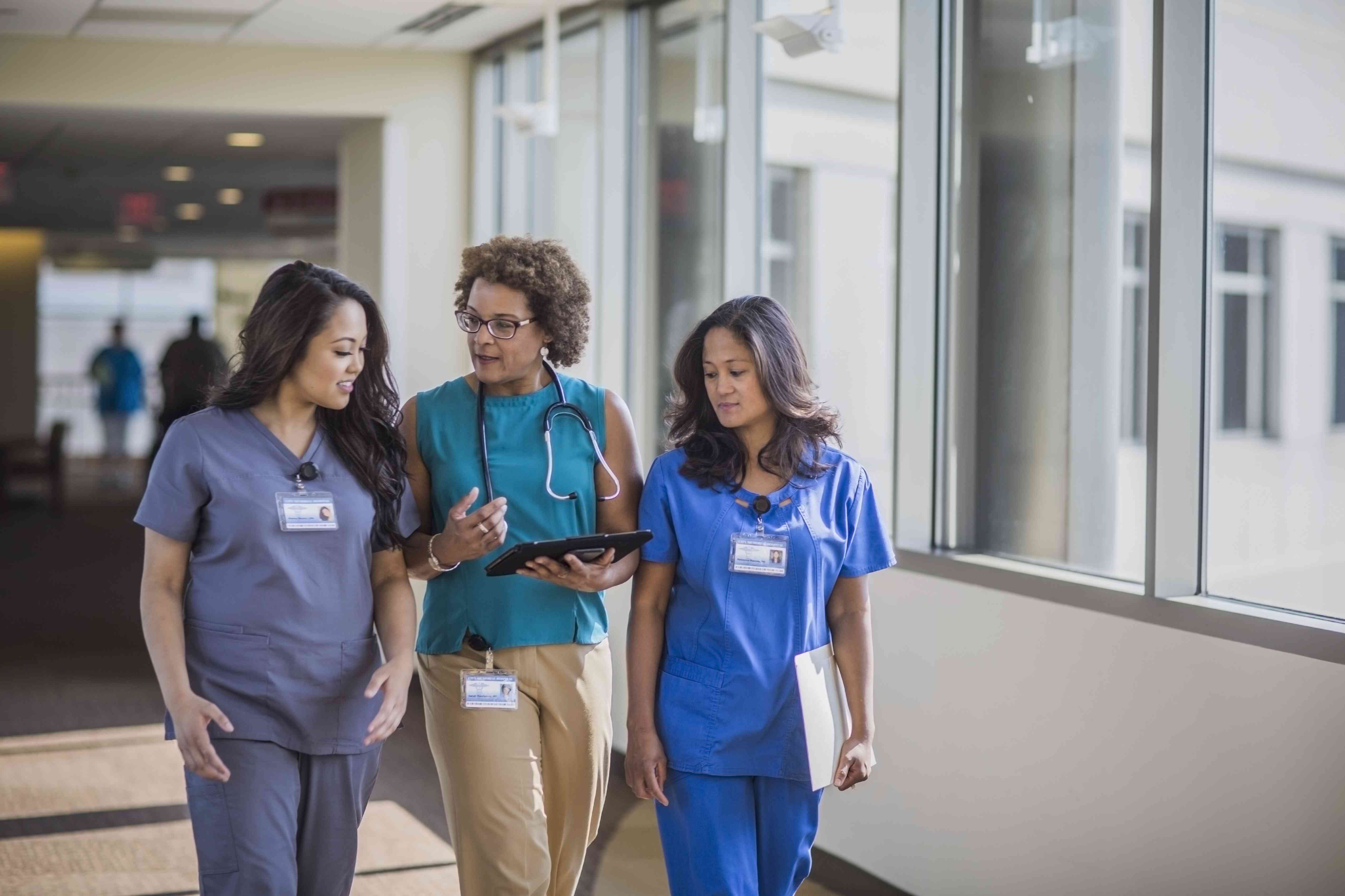 Doctors and nurses walking and discussing