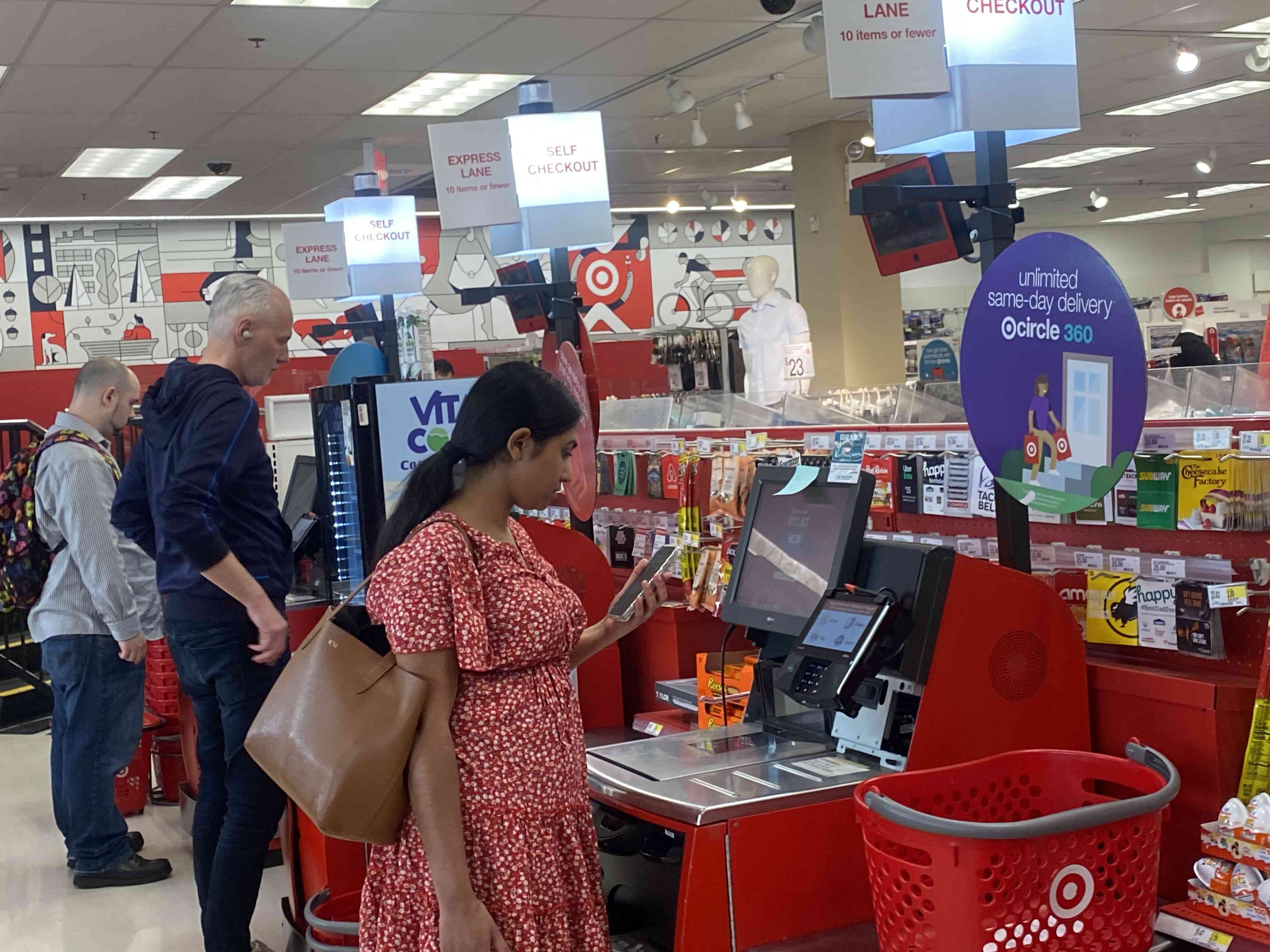 Customers using self service check out express lane at Target store, Queens, New York.