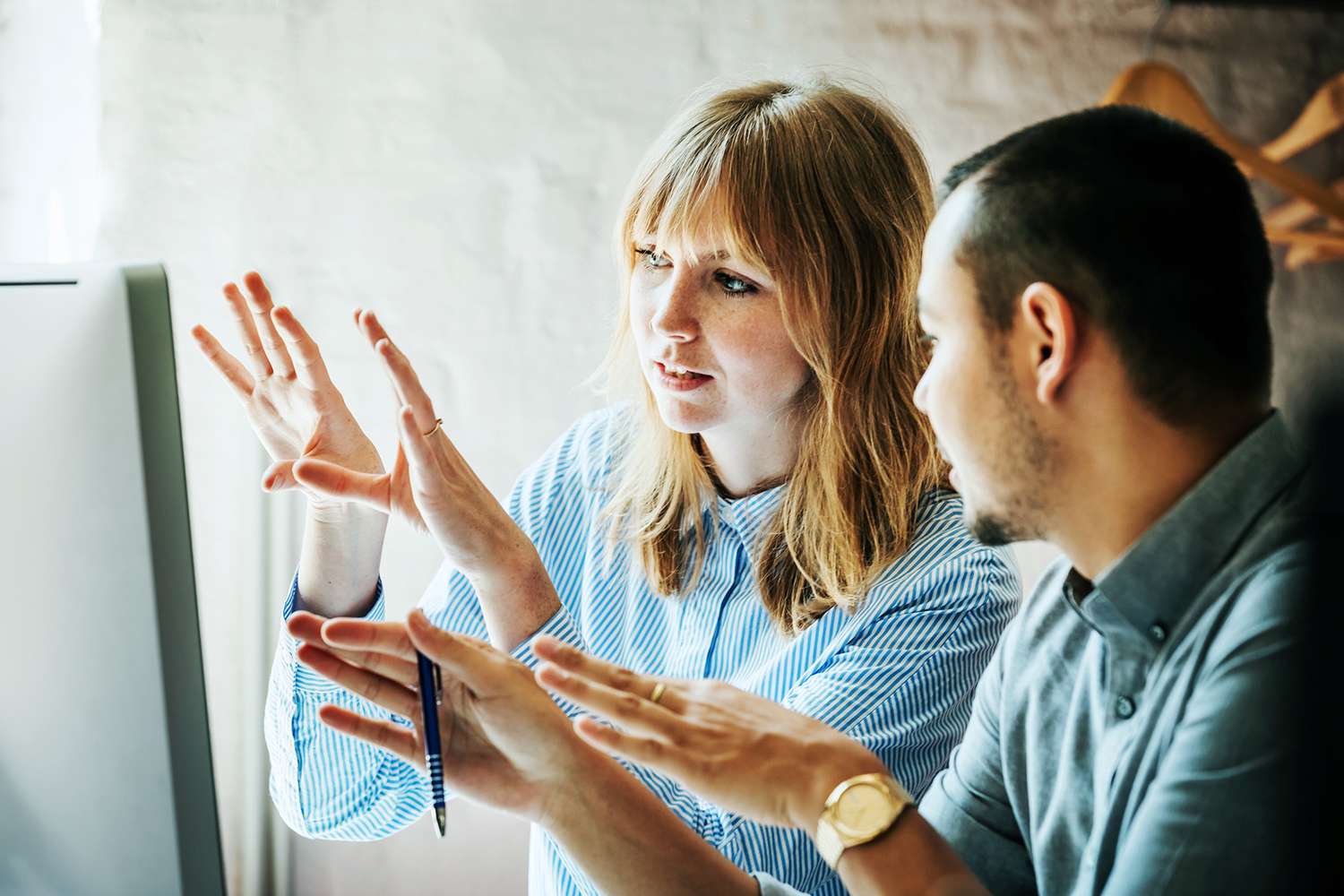 Financial advisor explaining to client at computer