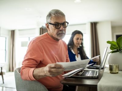 Senior couple looking at HELOC loans inside home