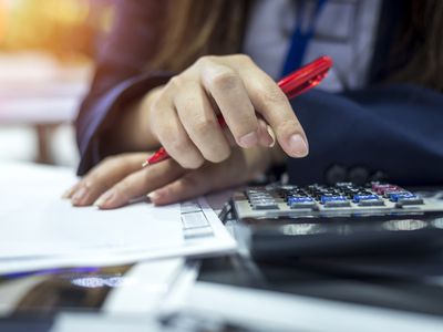 Woman Using Calculator