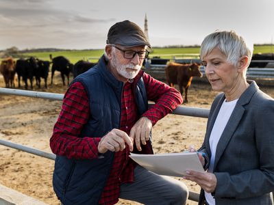 Mature farmer talking to finance consultation about applying for a USDA loan