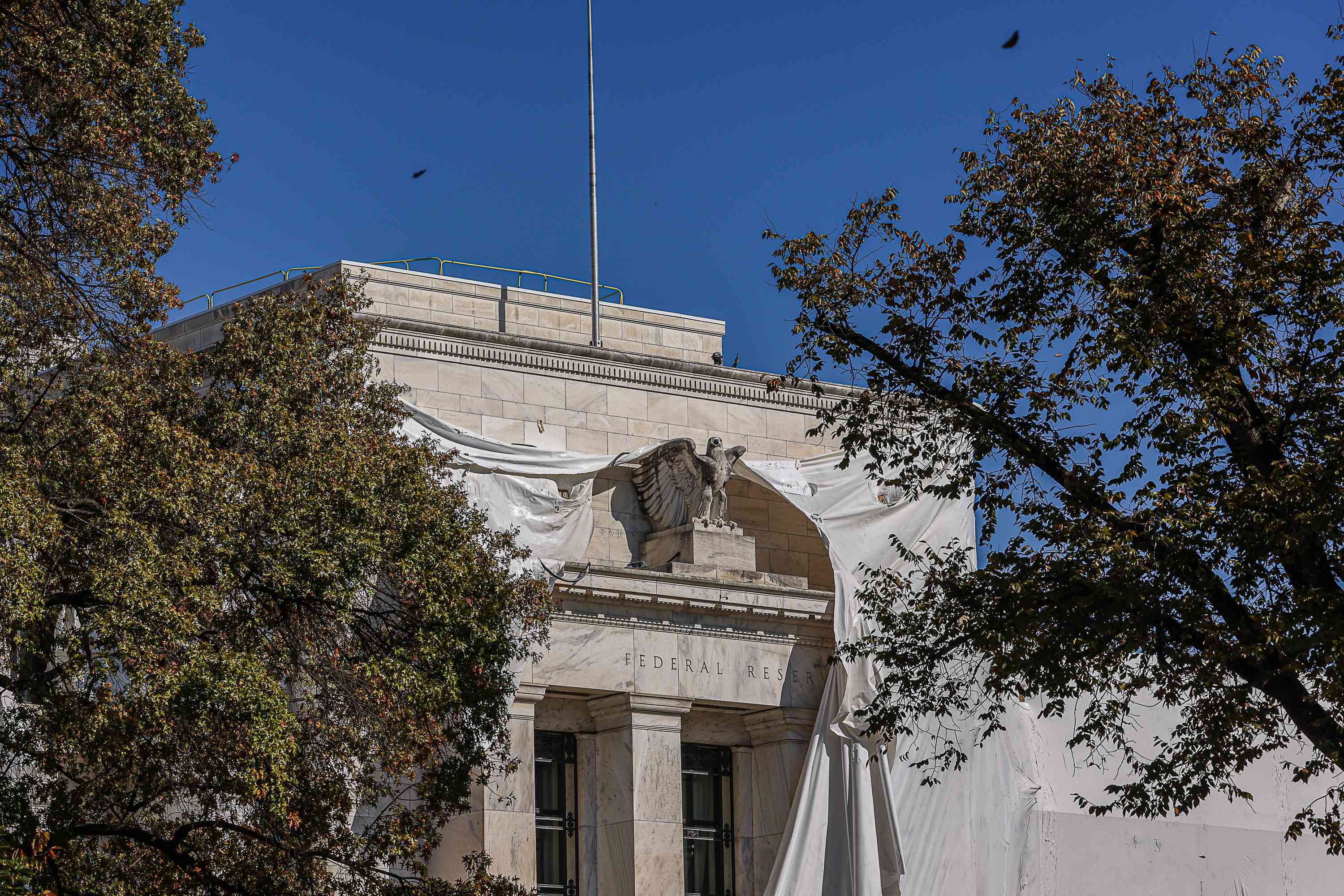 The Marriner S. Eccles Federal Reserve building during a renovation in Washington, DC, US, on Tuesday, Oct. 24, 2023. The Federal Reserve chair last week suggested the US central bank is inclined to hold interest rates steady again at its next meeting while leaving open the possibility of a future hike if policymakers see further signs of resilient economic growth. 