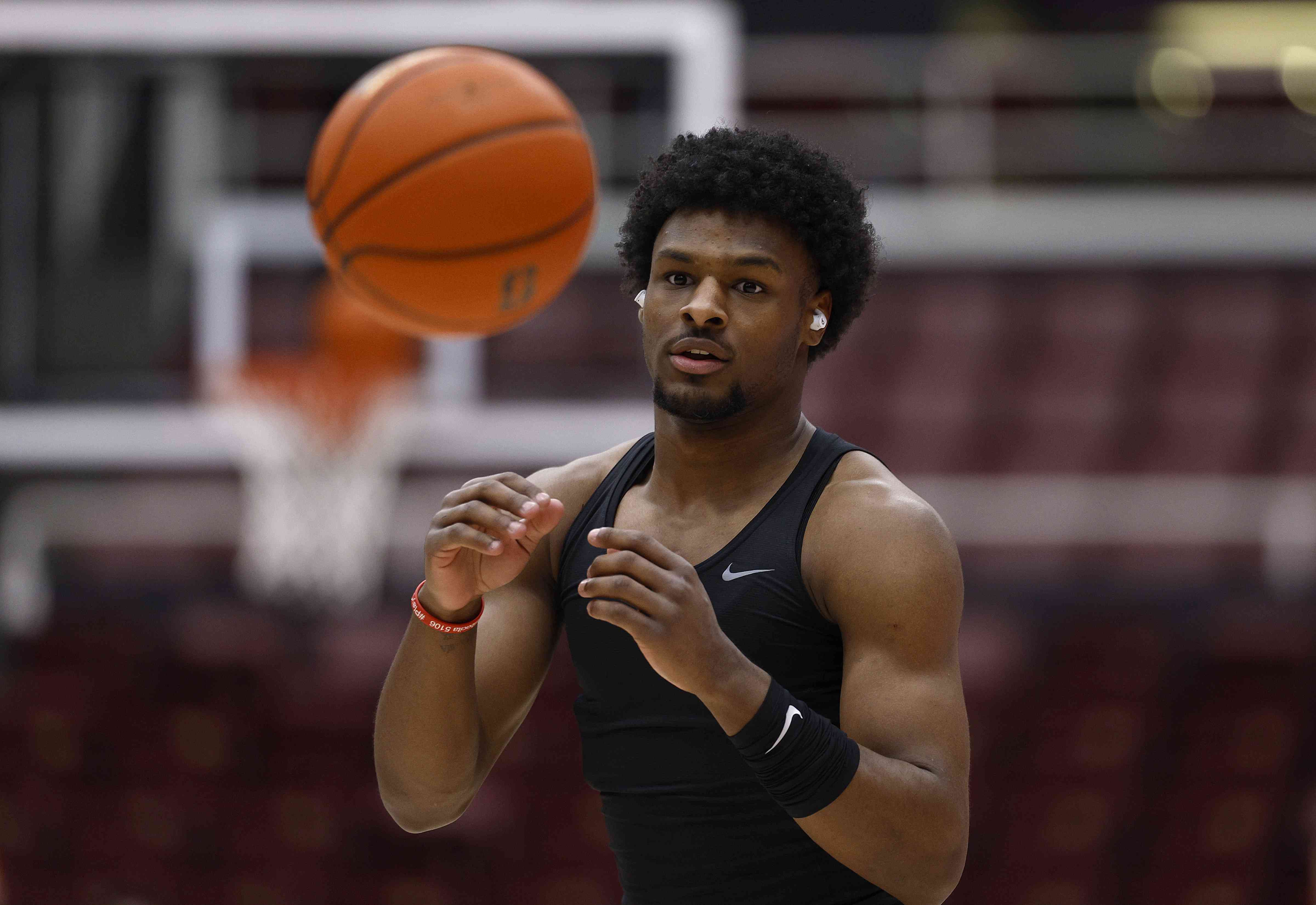 Bronny James of the USC Trojans warms up prior to the start of an NCAA basketball game.