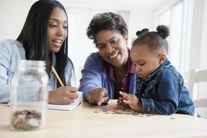 Family counting money with child