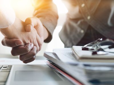 Business people shaking hands.