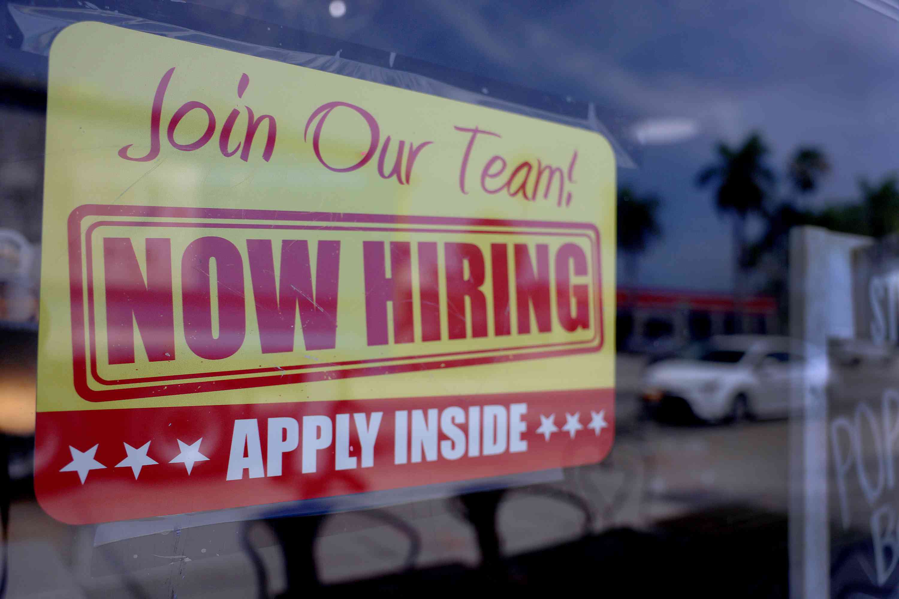 'Now Hiring' sign