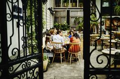 Multi-generational family dining at table in restaurant