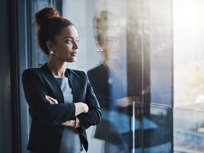 Young businesswoman looking out the window