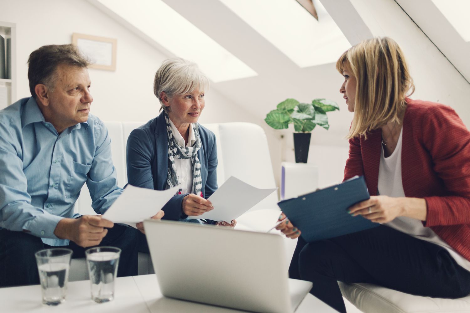 Mature Couple Meeting with Insurance Agent about cover note