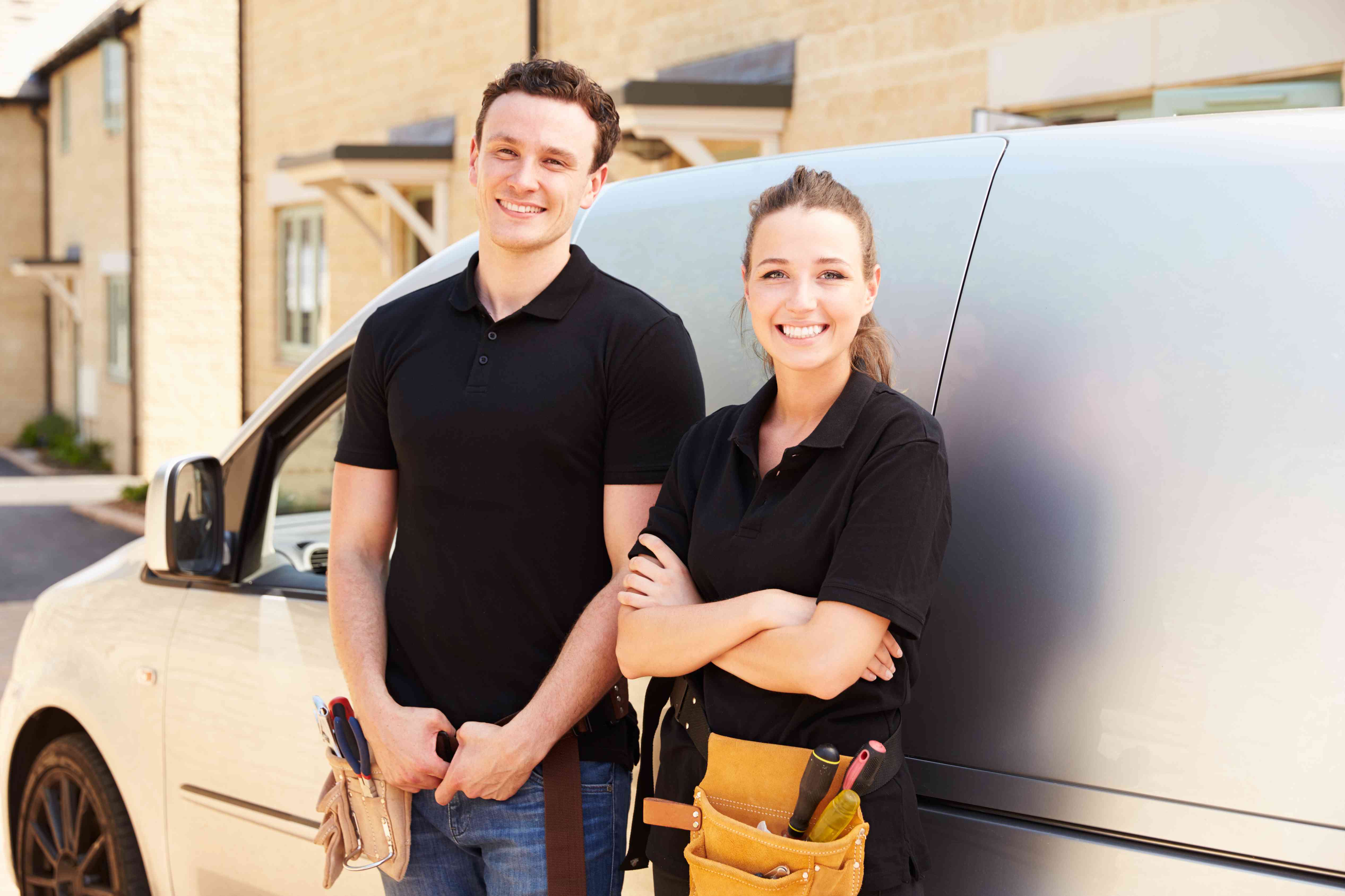 Couple standing by a van