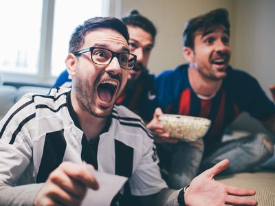 Group of men watching a game