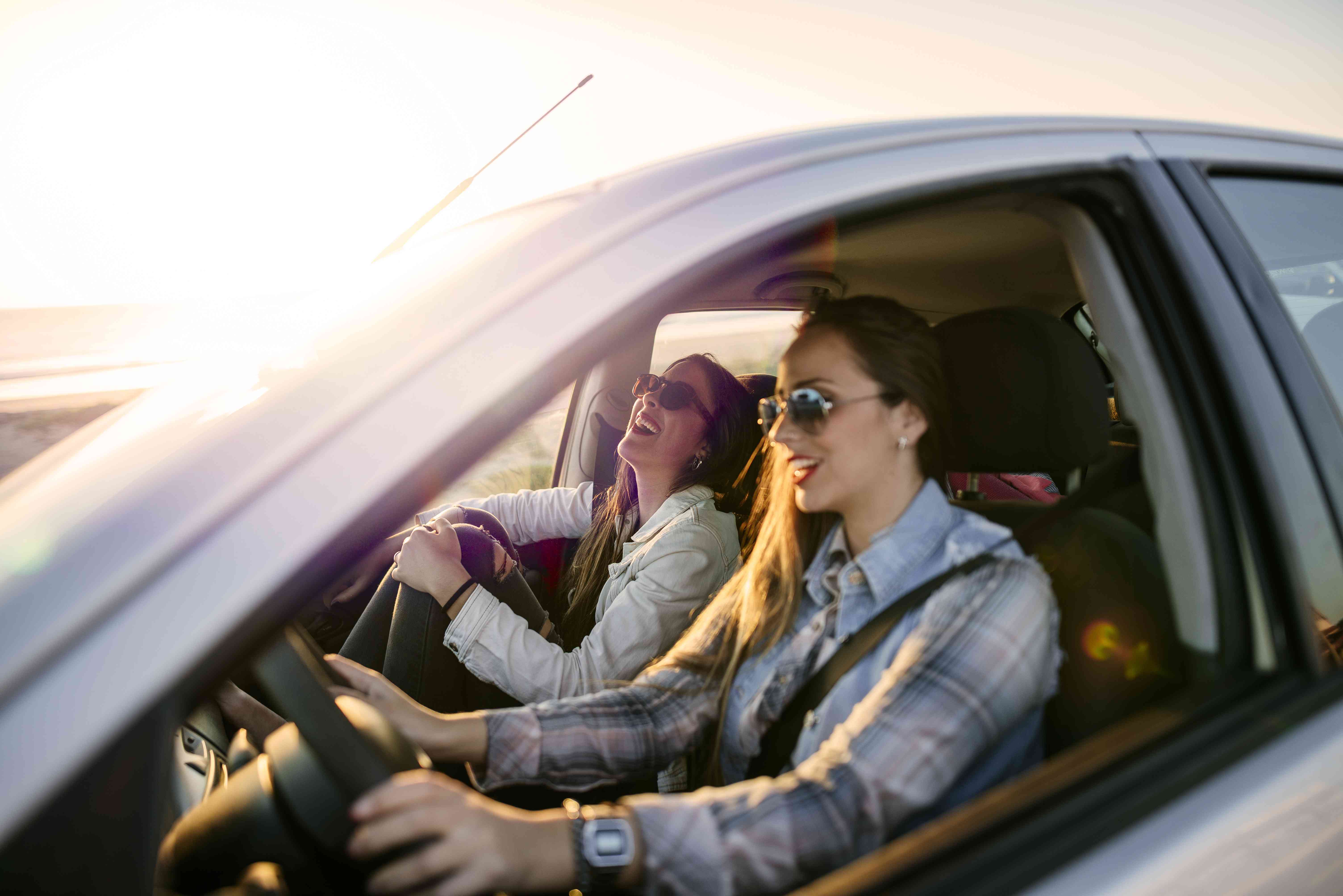 Two people drive in a car.