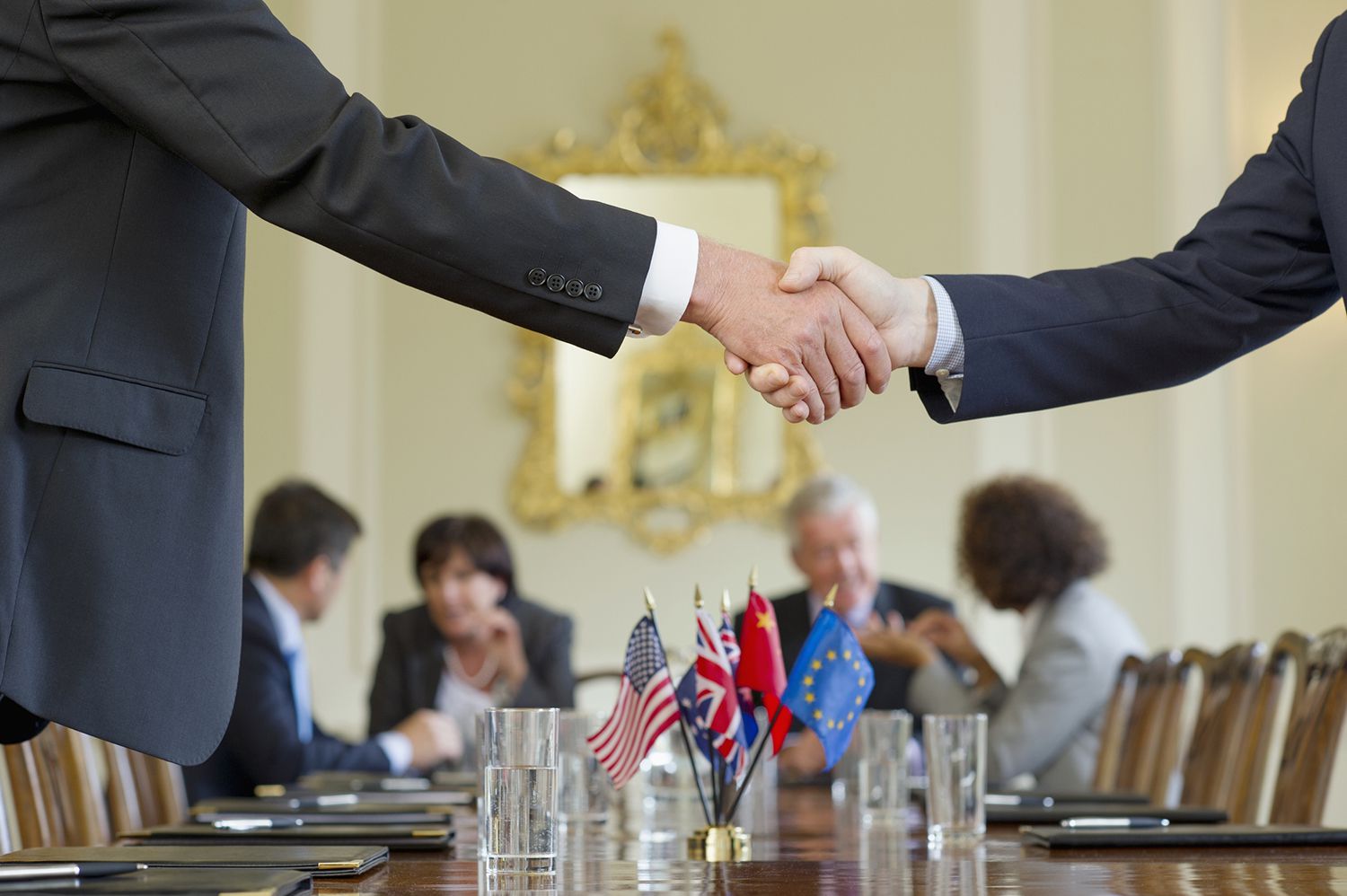 Businessmen Shaking Hands in Meeting