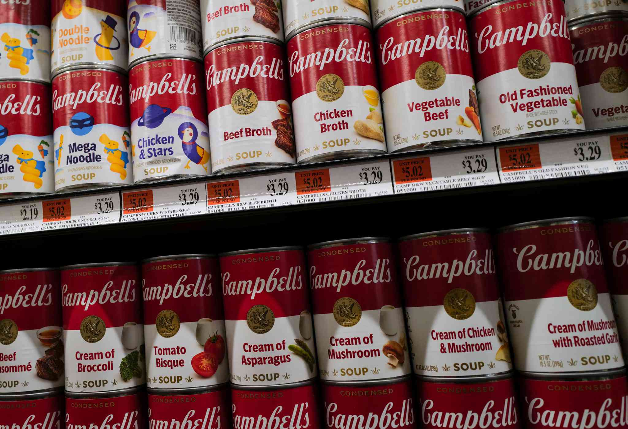 Cans of Campbell soup are displayed