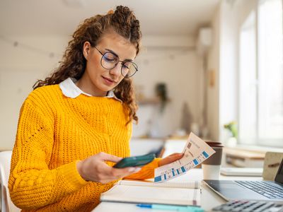 Woman looking at bank statement