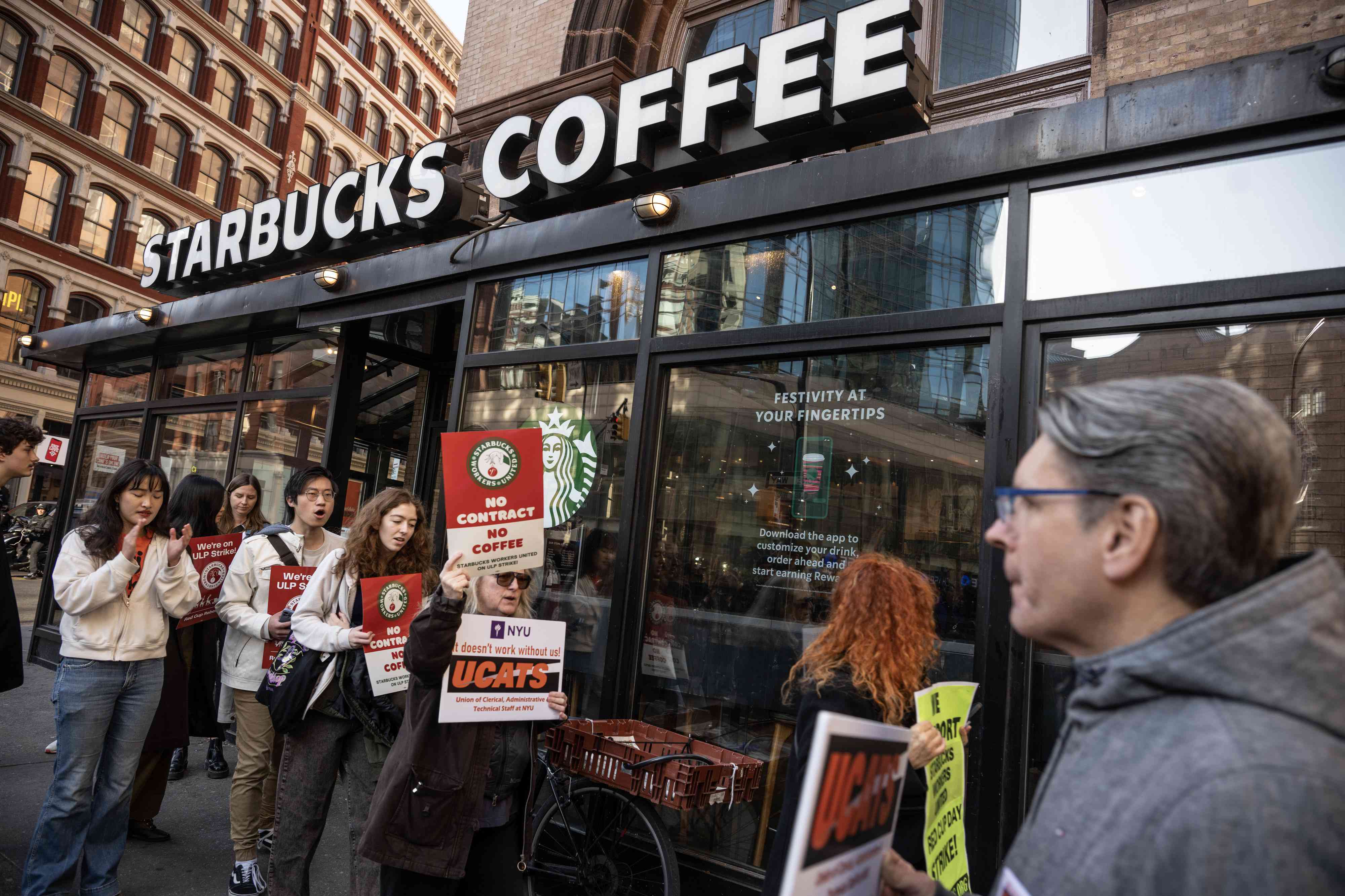 Starbucks workers on strike in November 2023 outside of one of the company's stores