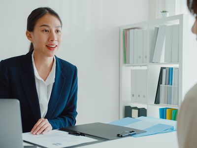 Corporate benefits officer discussing tax-sheltered annuities with employee