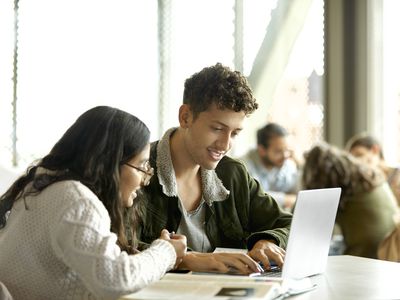 Two students comparing subsidized and unsubsidized student loans