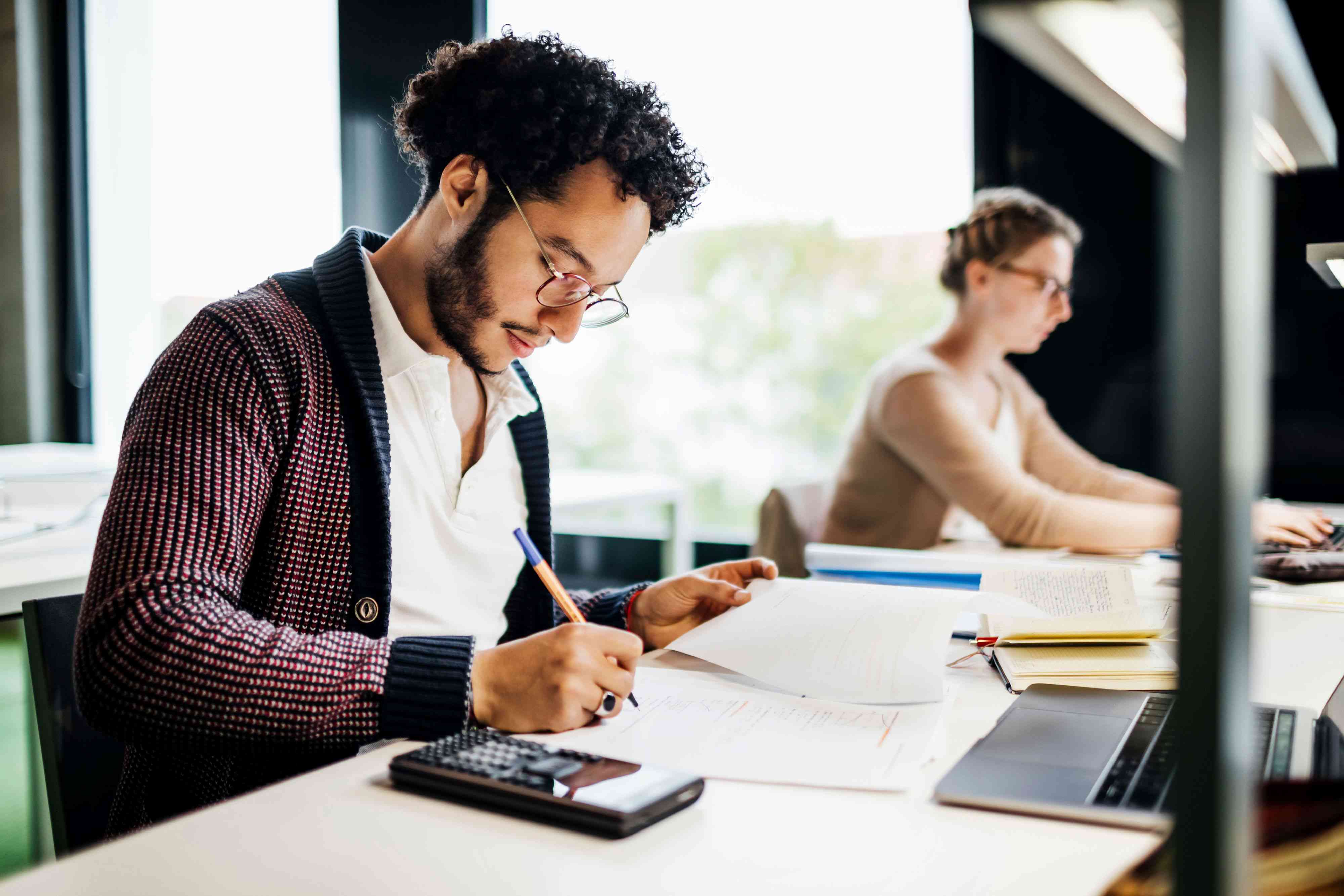 A student studies at a desk.