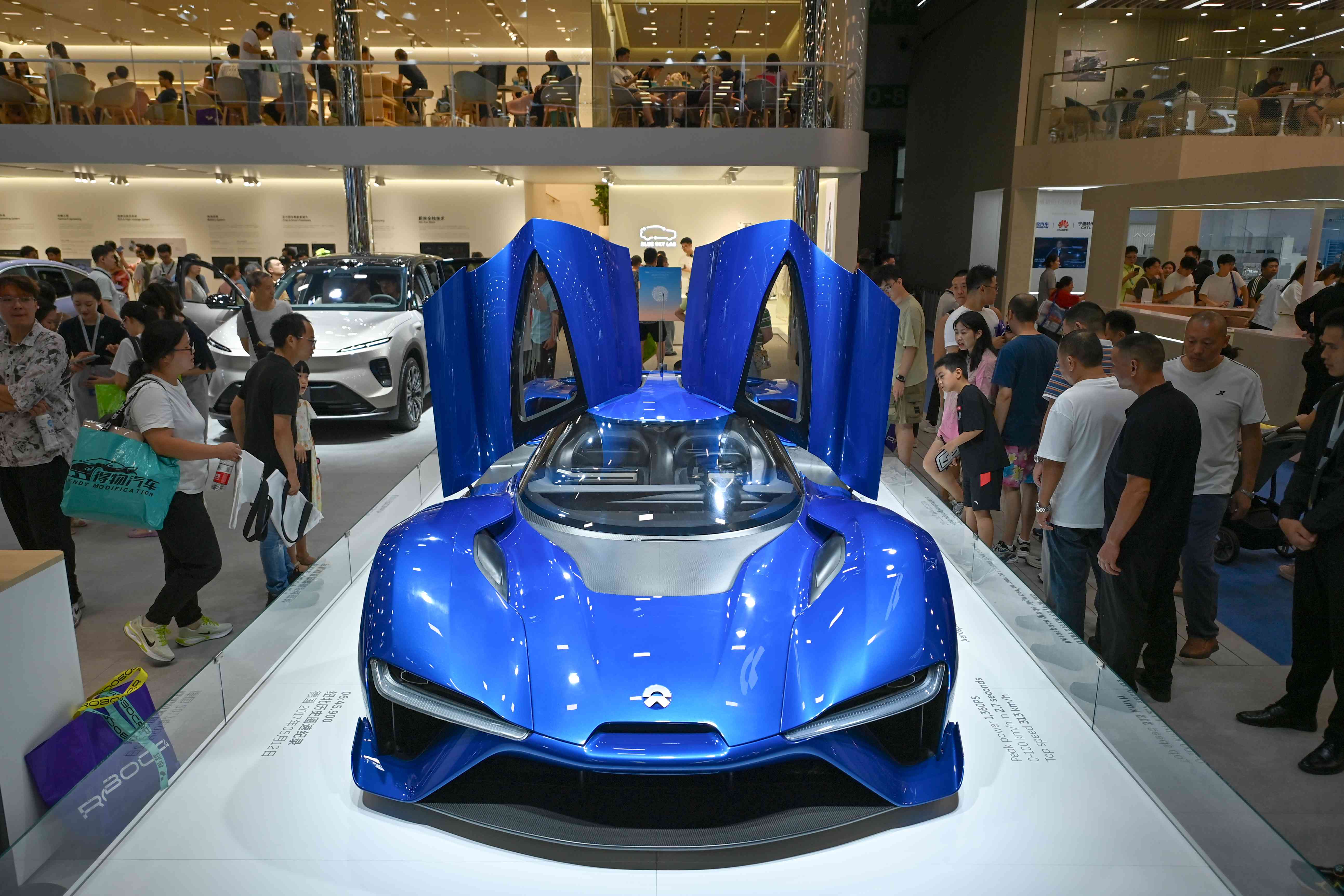 People view a Nio's new all-electric supercar EP9 during the 27th Chengdu Motor Show at Western China International Expo City on September 1, 2024 in Chengdu, Sichuan Province of China