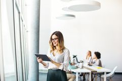 Businesswoman working on a tablet in an office