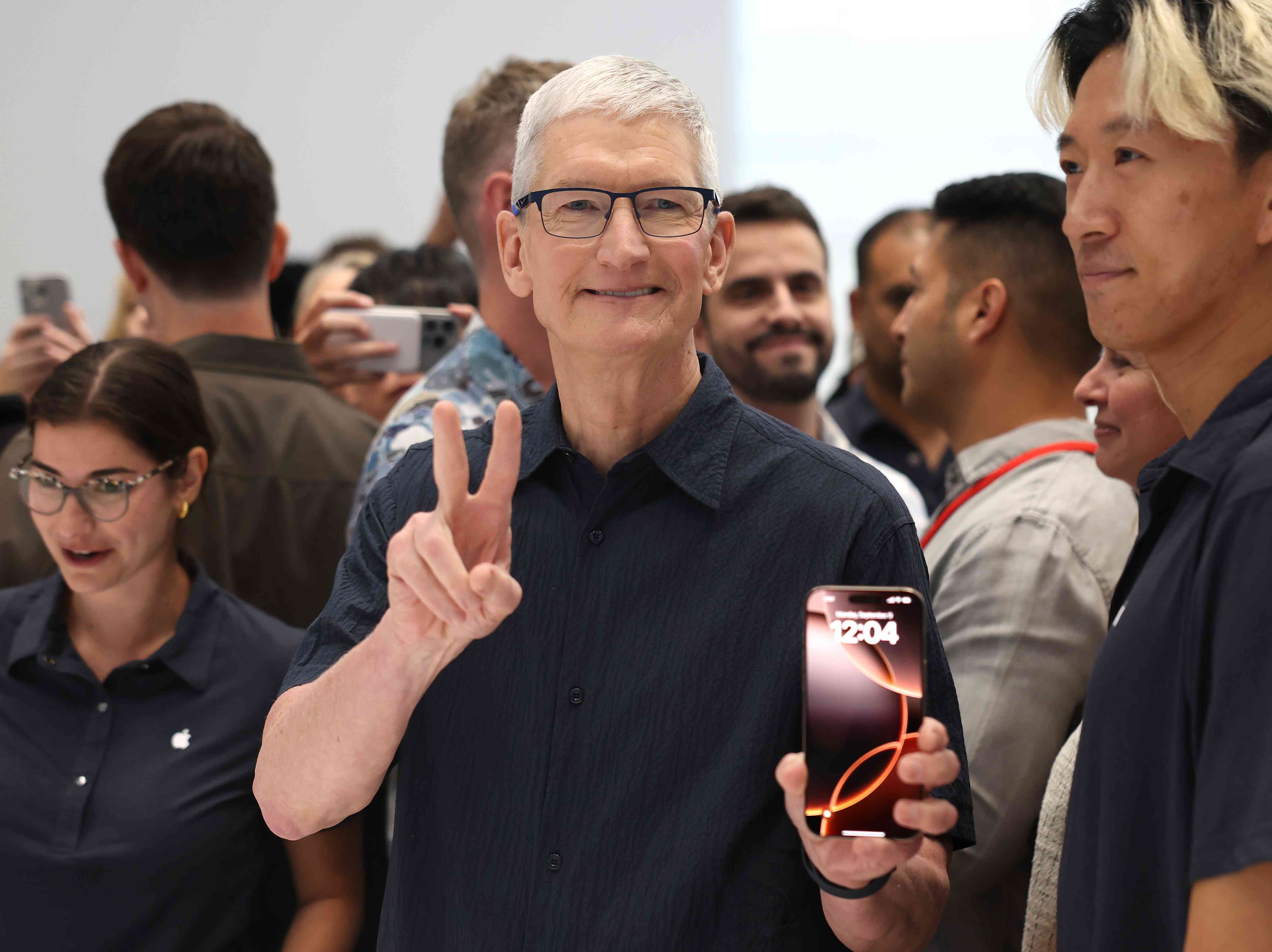 Apple CEO Tim Cook displays the new iPhone 16 during an Apple special event at Apple headquarters on September 09, 2024 in Cupertino, California.