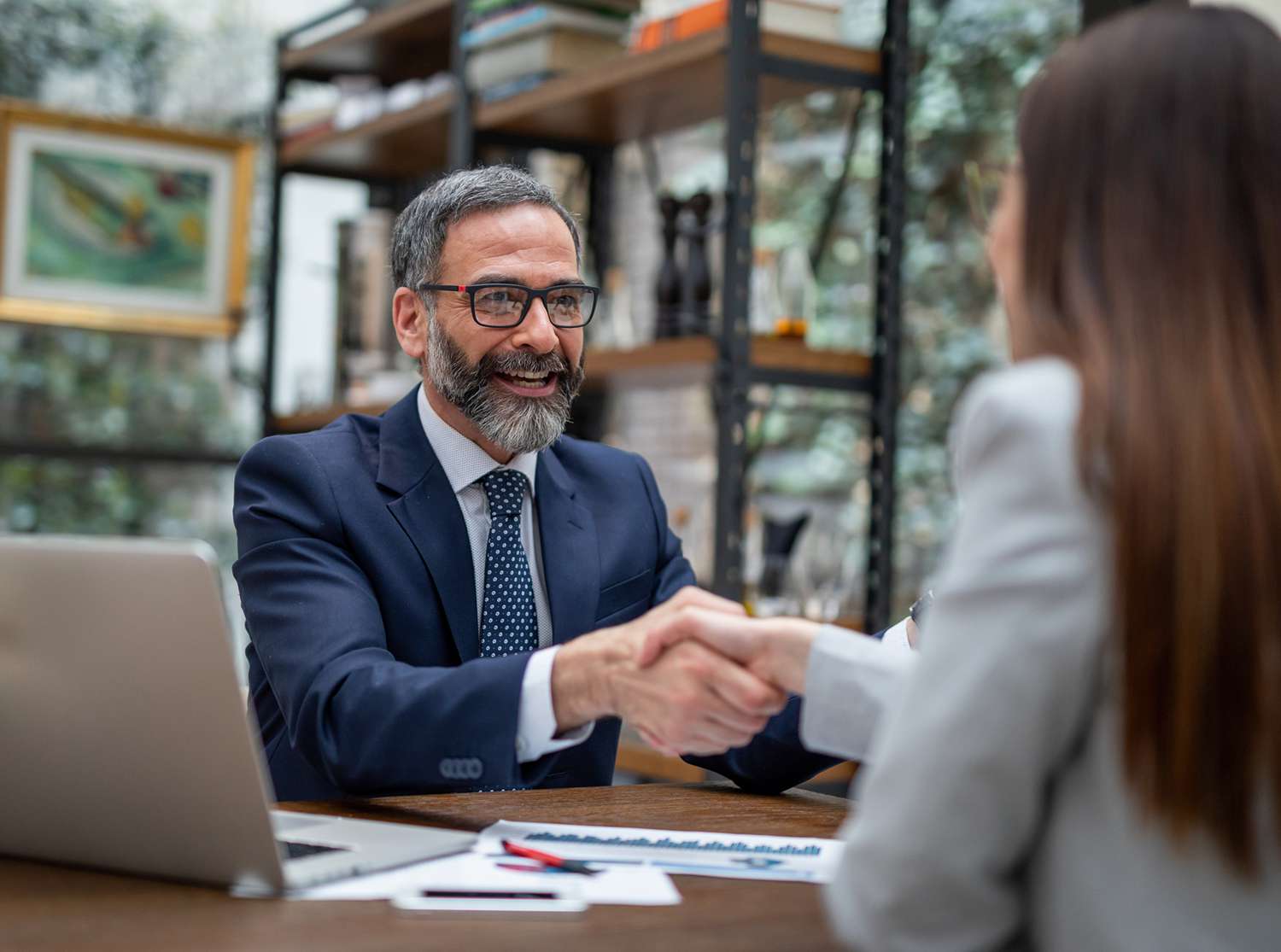 Executives Handshaking in a Coffee Shop