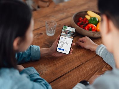 Couple browsing properties on real estate app