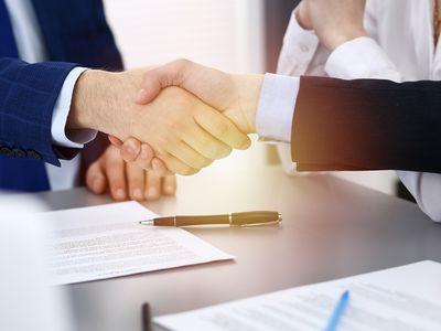 Business People Shaking Hands, Finishing up a Papers Signing