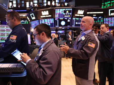 : Traders work on the floor of the New York Stock Exchange 