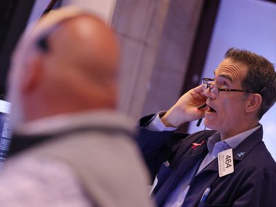 Traders work on the floor of the New York Stock Exchange.