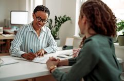 Two women in a meeting in an office