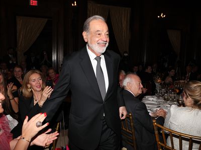 Honoree Carlos Slim HelÃÂº walks to the stage during the Sophia Awards of Excellence