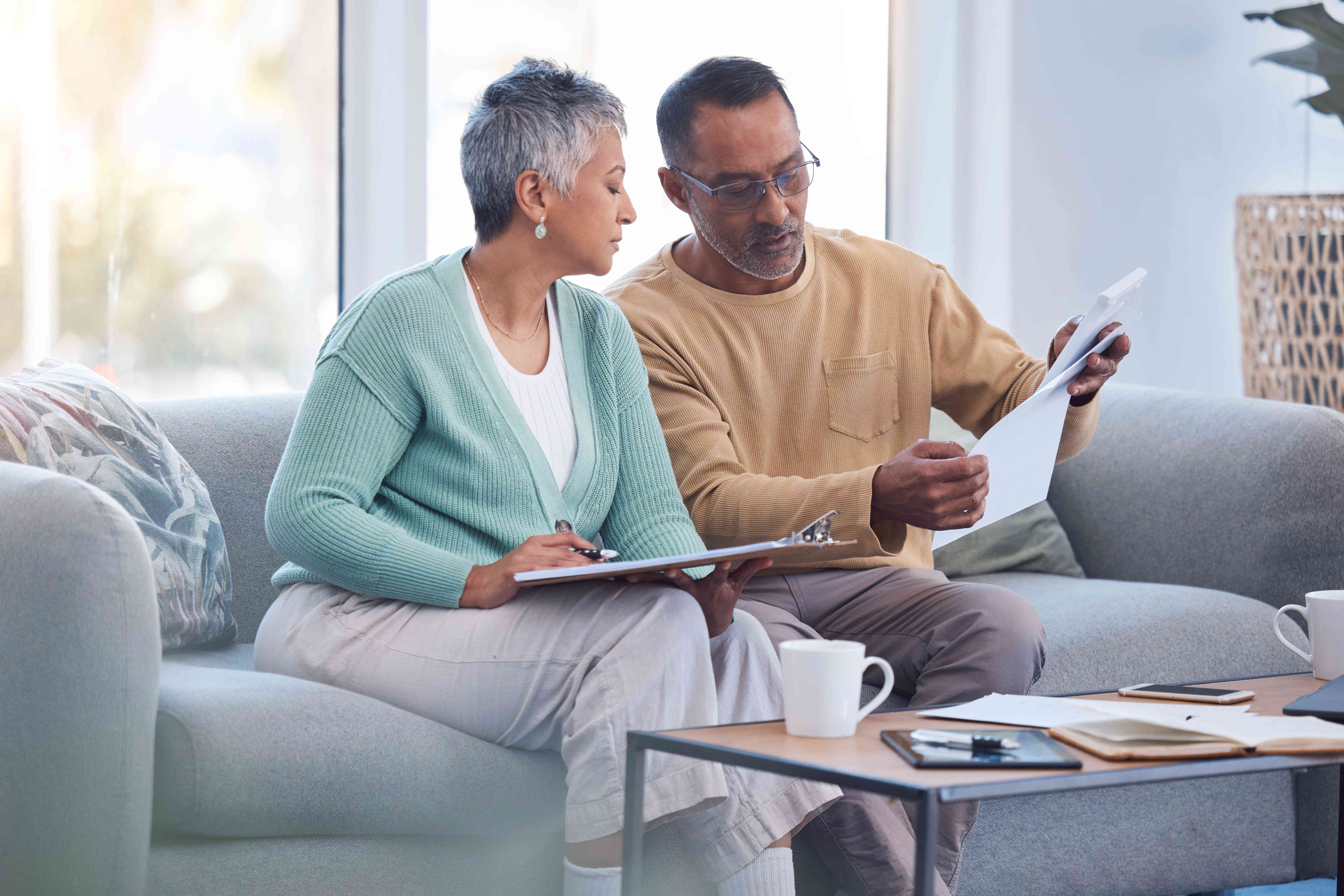 Senior couple discussing insurance documents