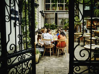 Multi-generational family dining at table in restaurant