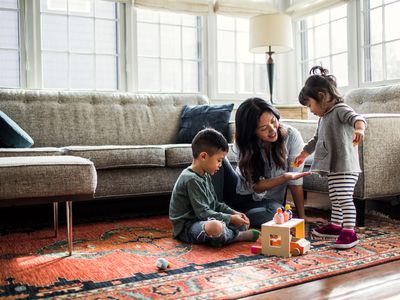 A family relaxes in a living room.