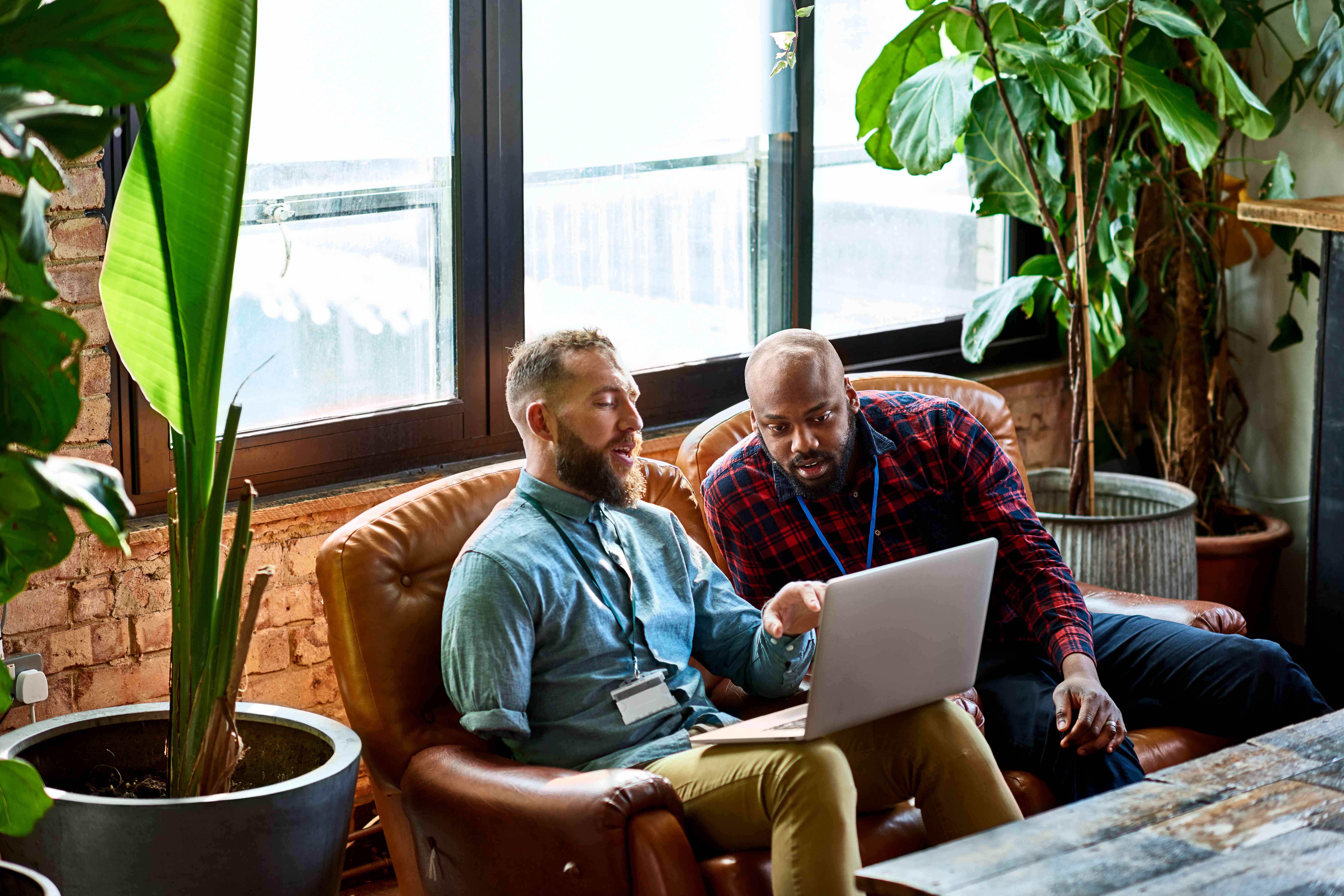 Two insurance agents discussing insurance score 