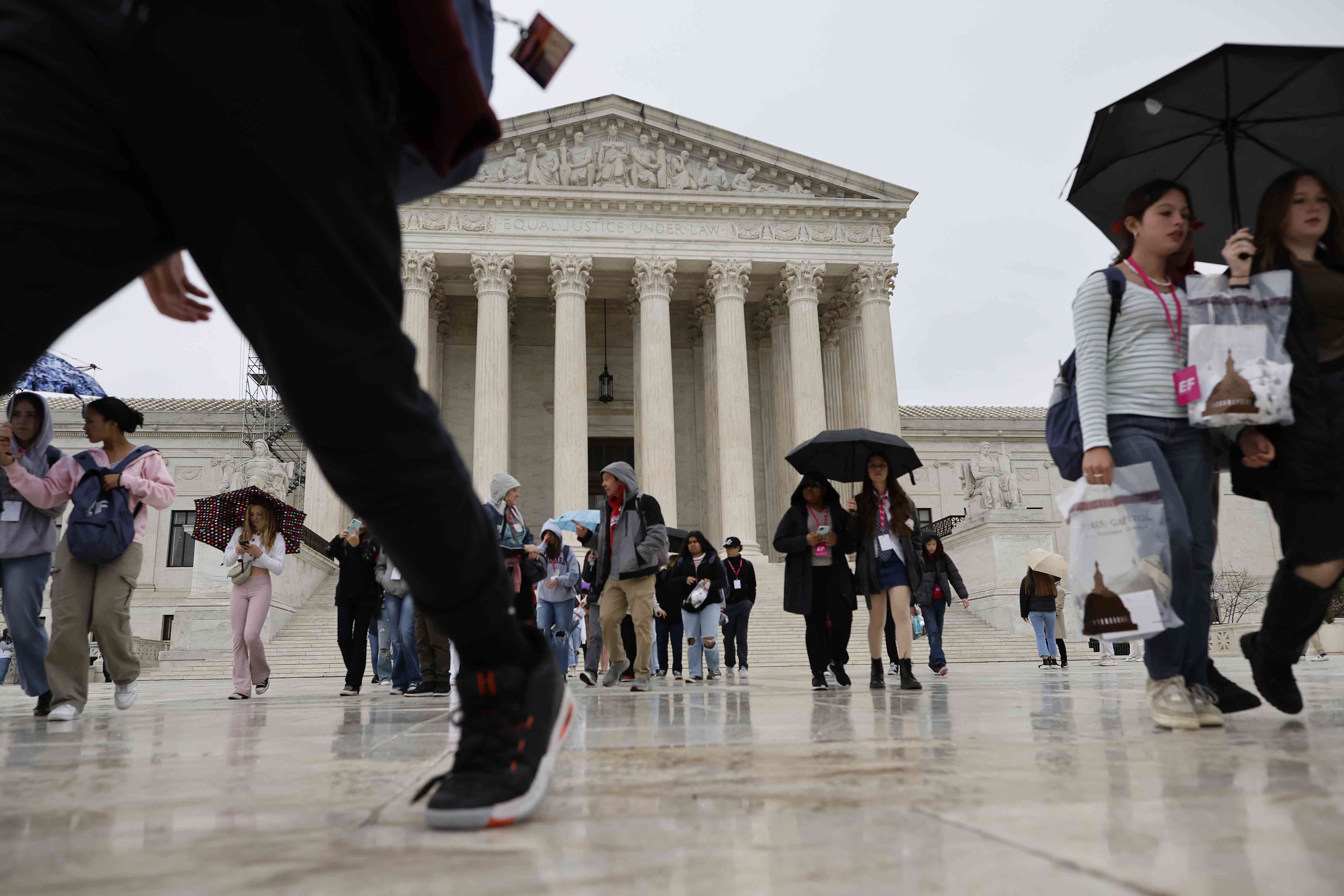 Tourists move through the plaza in front of the U.S. Supreme Court building April 07, 2023 in Washington, DC. According to a ProPublica report published Thursday, Supreme Court Associate Justice Clarence Thomas failed to include in his financial disclosures that for decades he was treated to luxury vacations by Texas real estate magnate and Republican mega-donor Harlan Crow. 