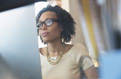 Black woman at a computer