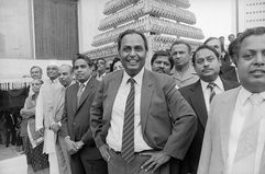 Indian industrialist Dhirubhai Ambani (1932 - 2002, centre) with guests at the wedding of his son Mukesh Ambani to Nita Ambani, Mumbai, circa 1985.