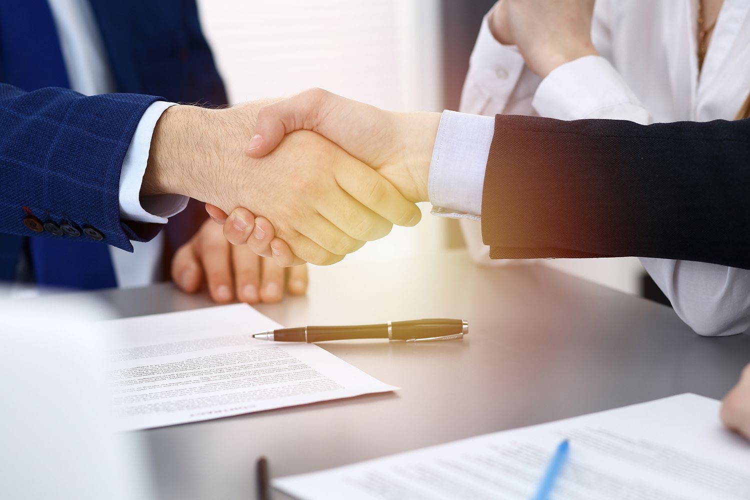 Business People Shaking Hands, Finishing up a Papers Signing