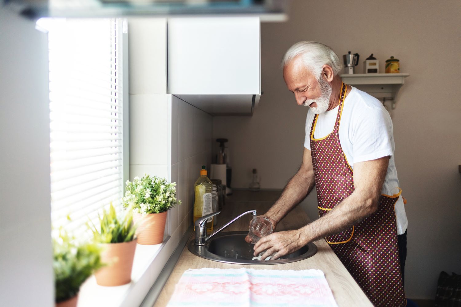 Man at a kitchen sink