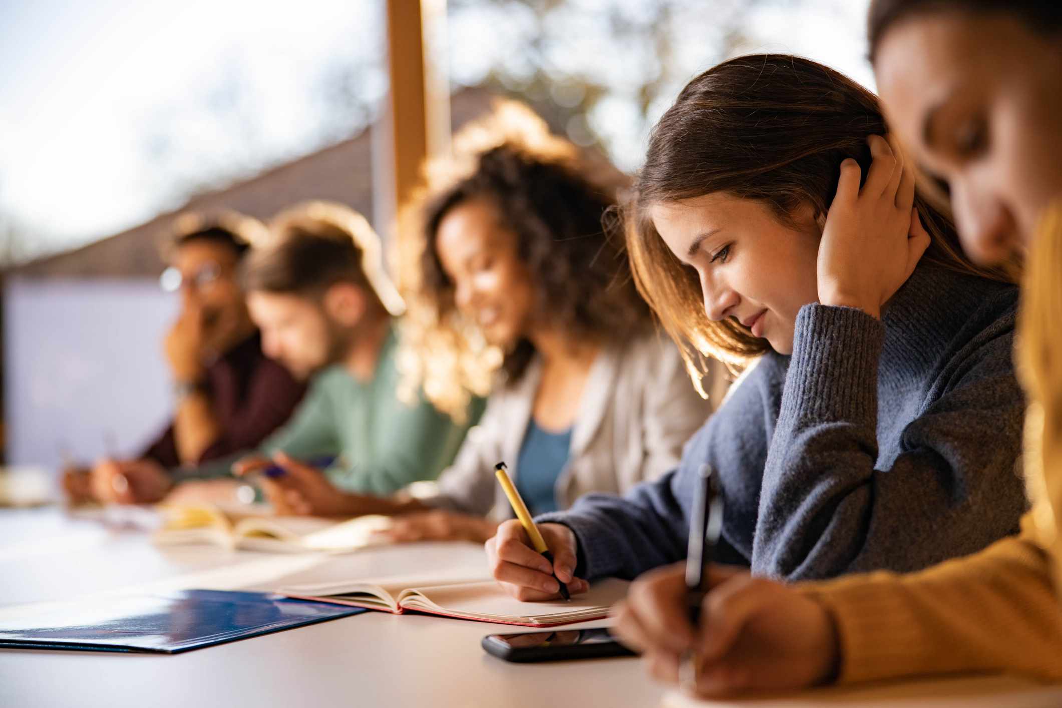 Student studying and wondering what her student loans can be used for