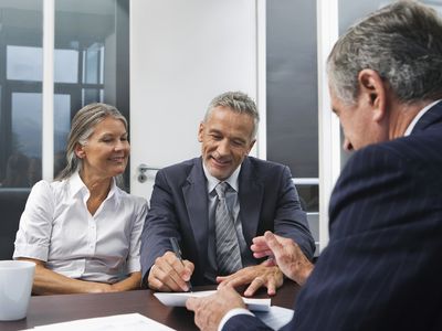 Middle Aged Couple Talking to Financial Advisor