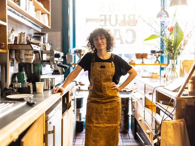 Portrait of a non-binary young person working as a barista