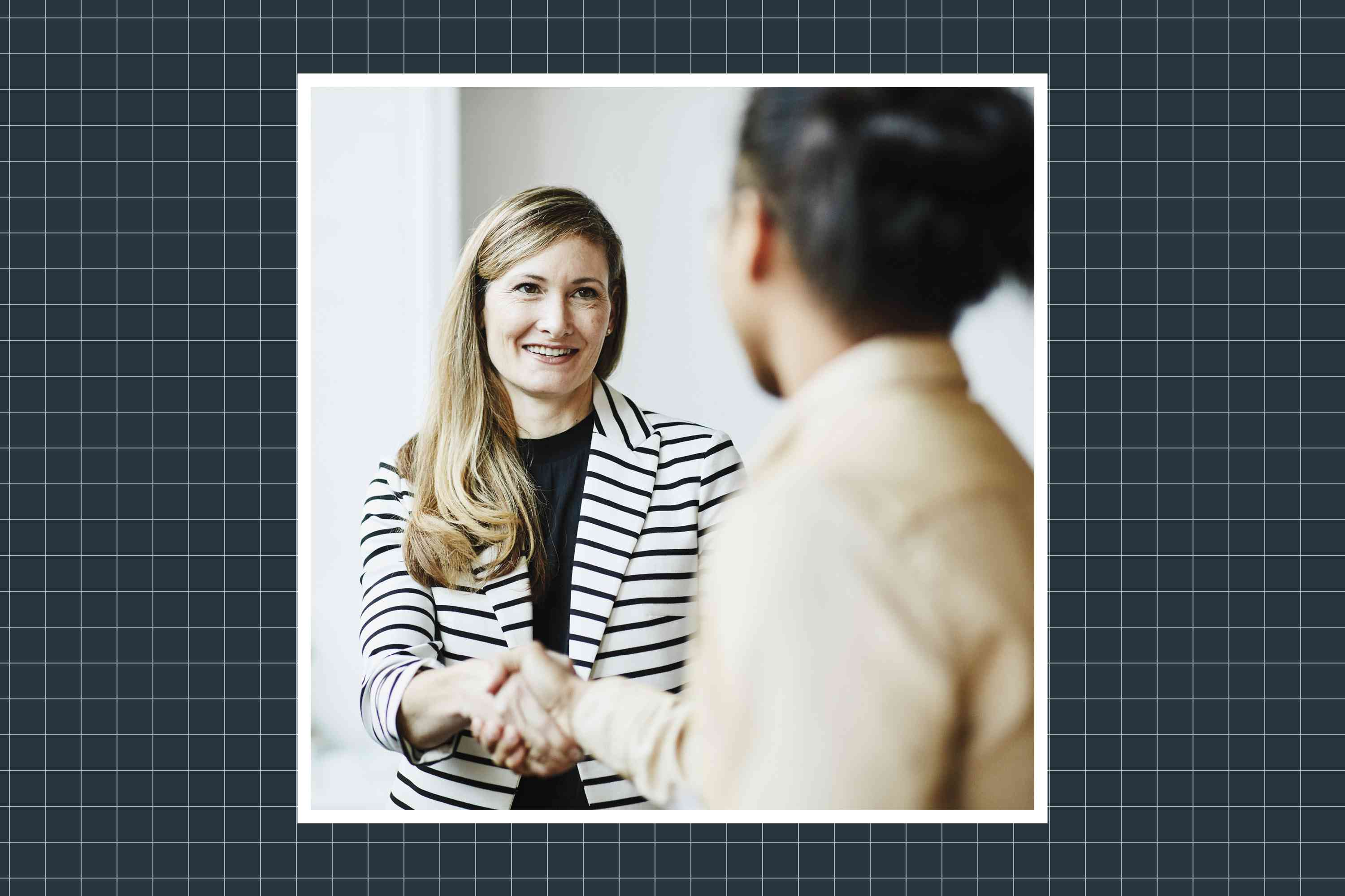 two women shaking hands